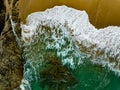 Bird eye view seashore with big wave crashing on rock cliff. Beautiful waves sea surface in sunny day summer background, Amazing Royalty Free Stock Photo