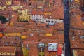 Bird-eye view from the top of the tower ancient colorful buildings under red tile roofs. Bologna old town center Royalty Free Stock Photo