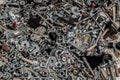 Various and so many scraps, pins, screws, nuts, bolts and washers placed all together on a wooden plank Royalty Free Stock Photo
