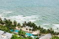 Bird eye view of white sand beach, coconut palm trees, hotels, resorts and tropical sea surf on Koh Chang island in Thailand Royalty Free Stock Photo