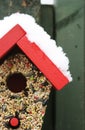 Bird feeder in snow Royalty Free Stock Photo