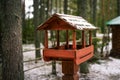 Bird feeders. Birdhouse in the winter forest