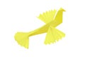 A bird figure made of yellow paper on a white background is isolated. Origami