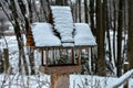 a bird house in the garden in winter with snow Royalty Free Stock Photo