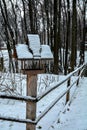 a bird house in the garden in winter with snow Royalty Free Stock Photo