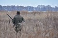 Bird Hunter with his dog in the field