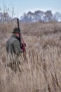 Bird Hunter with his dog in the field Royalty Free Stock Photo