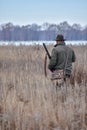 Bird Hunter with his dog in the field