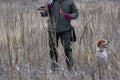 Bird Hunter Silhouetted at Sunrise with gun gun on his hand Royalty Free Stock Photo