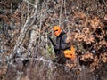 A Bird Hunter Stalks Prey Through The Woods In Winter