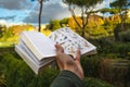 Bird Identification field guide in hand walking