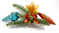 Bird near spruce branch with christmas tree toys