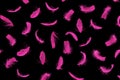 Bird pink falling feather texture pattern isolated on black background Royalty Free Stock Photo