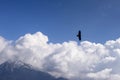 Bird of pray flying above the clouds, Orobie Royalty Free Stock Photo