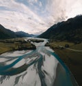 Bird's eye aerial drone view of Glenorchy-Paradise Road crossing over Rees River near Glenorchy, Lake Wakatipu and Royalty Free Stock Photo
