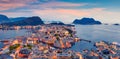 From the bird`s eye view of Alesund port town on the west coast of Norway, at the entrance to the Geirangerfjord. Colorful sunset Royalty Free Stock Photo