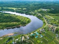 Bird`s-eye view of the bend of the river and the village Vazhinka Kurapovo village, Leningrad region.