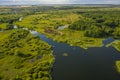 Bird`s-eye view of the bends of the river meadows and fields