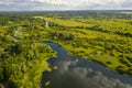 Bird`s-eye view of the bends of the river meadows and fields