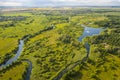 Bird`s-eye view of the bends of the river meadows and fields