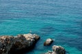 Bird's eye view of the blue sea, rocks in clear water, azure beach. Beautiful landscape of the sea coast, stones in