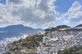 Bird`s-eye view of a cityscape with houses and buildings on the hills of Nagasaki city.