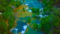 Bird`s Eye View of Croatia, Europe ; Last sunlight lights up the pure water waterfall on Plitvice National Park. Colorful spring