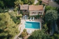 bird's-eye view of elegant mediterranean house, with private swimming pool and lush garden