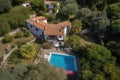 bird's-eye view of elegant mediterranean house, with private swimming pool and lush garden