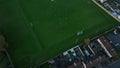 Bird's eye view . A game of hurling at a school stadium with players in Ireland