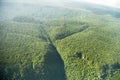 Bird`s-eye view of the jungle with hills mountains, taken from the plane Royalty Free Stock Photo