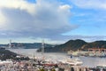 Bird`s-eye view from Kazagashira park of the Nagasaki port with shipyards and Megami Bridge in background.