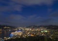 Bird\'s-eye view at night of the Costa Serena Genova cruise ship moored in the illuminated Nagasaki port. Royalty Free Stock Photo
