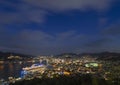 Bird\'s-eye view at night of a cruise ship moored in the illuminated Nagasaki port. Royalty Free Stock Photo