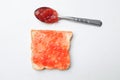 strawberry jam, fresh red berries in a spoon spread slice of bread isolate on a white backdrop