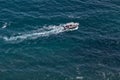 Bird`s-eye-view on sea with motor boat with tent Royalty Free Stock Photo