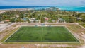 Bird`s eye view shot of the soccer pitch at the Maamigili tropical island at the Alif Dhaal Atoll at the indian ocean