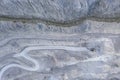 Bird`s eye view to stone pit quarry with shovel excavator Royalty Free Stock Photo