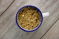 Bird seed in an enamel cup Royalty Free Stock Photo