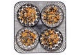 Bird seeds. Close-up of a decorative plate with four bowls with black sunflower seeds and other seed and nuts for feeding wild Royalty Free Stock Photo