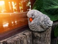 Bird statue made of cement on the wooden Royalty Free Stock Photo