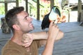 Bird tamer working with a toucan