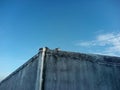 Old barn with blue sky and birds