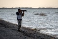 Bird Watcher Silhouette photographer on beach