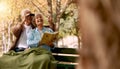 Bird watching, book and senior couple in a park, retirement hobby and holiday adventure in Sweden. Bird search, elderly Royalty Free Stock Photo