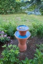 Bird waterer in a garden Royalty Free Stock Photo