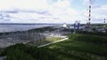 Bird's-eye view. Clip.Green forest around the river with plants around and pipes and white clouds around. Royalty Free Stock Photo