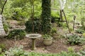 Birdbath near wooden swing