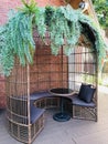 Birdcage-shaped living table set made of rattan. Royalty Free Stock Photo