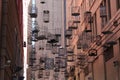 Birdcages suspended over city street